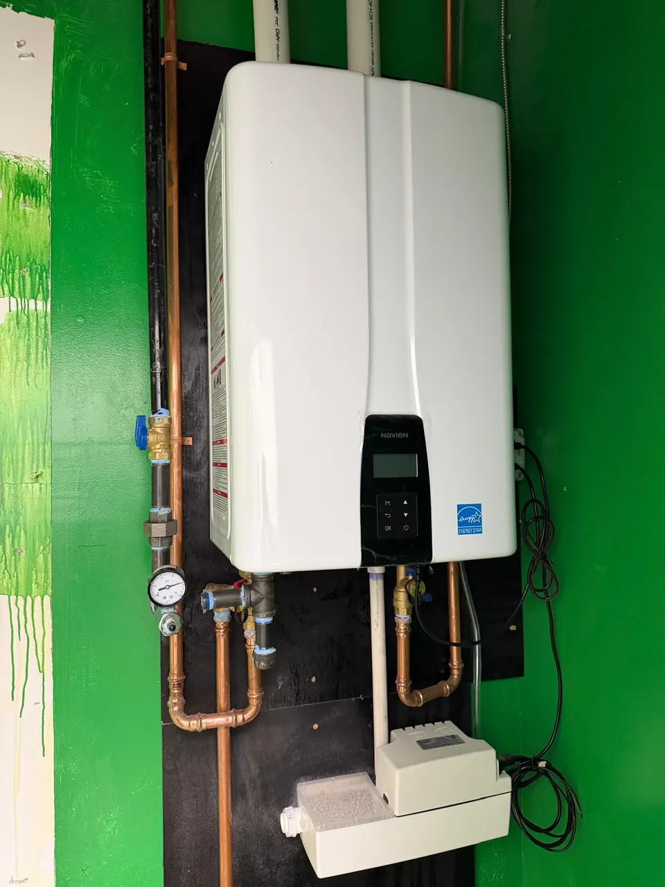 Wall mounted Navien tankless water heater with new copper piping