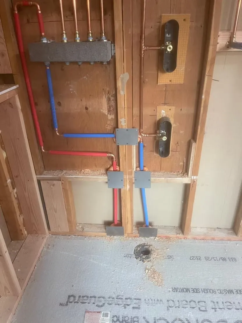PEX supply lines and manifold in an open wall
