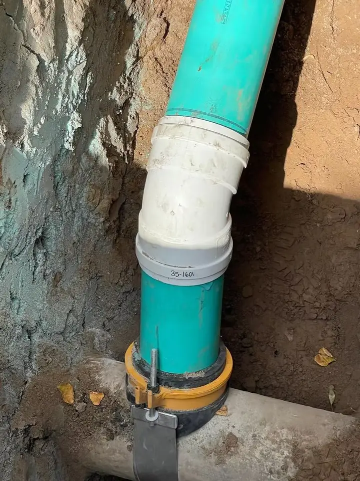 PVC sewer pipe joint with code compliant fittings